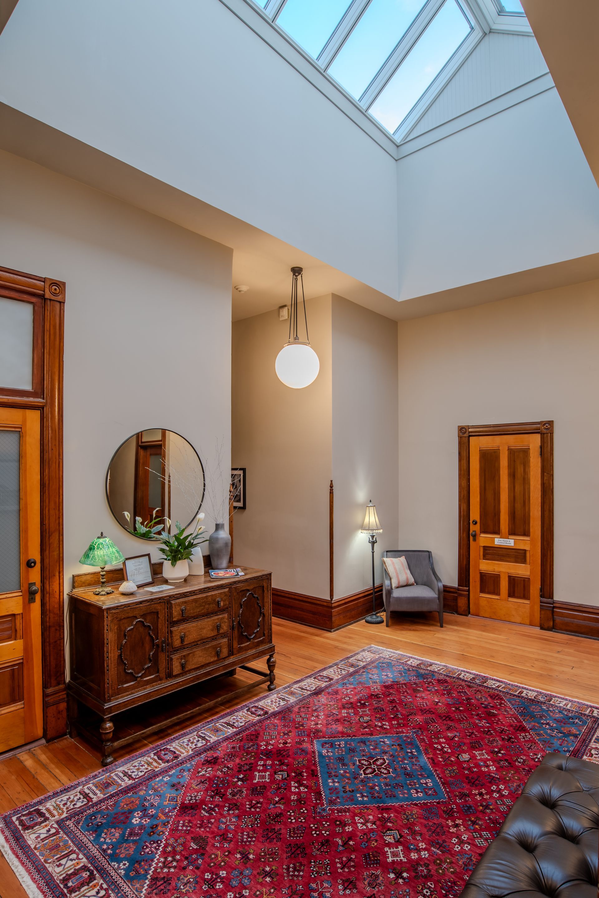 There is a skylight in the ceiling of the room.