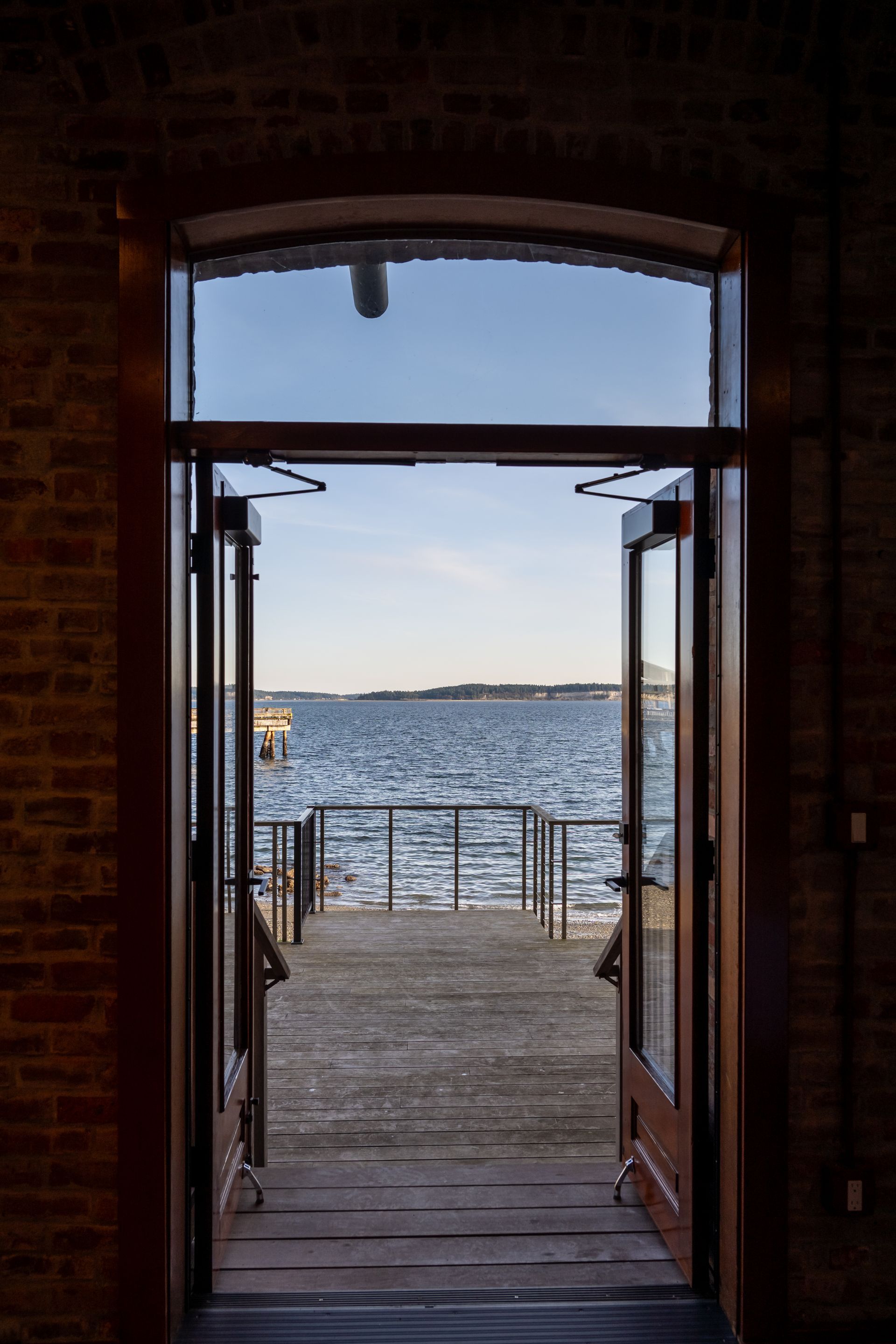 A view of a body of water through an open door
