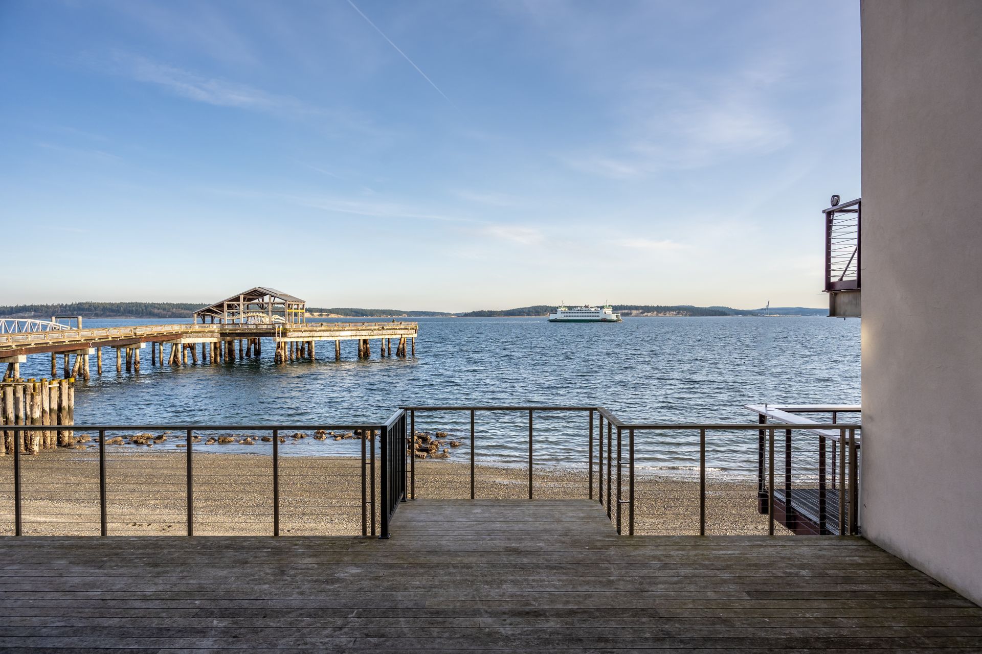 A staircase leading to a pier overlooking Port Townsend Bay