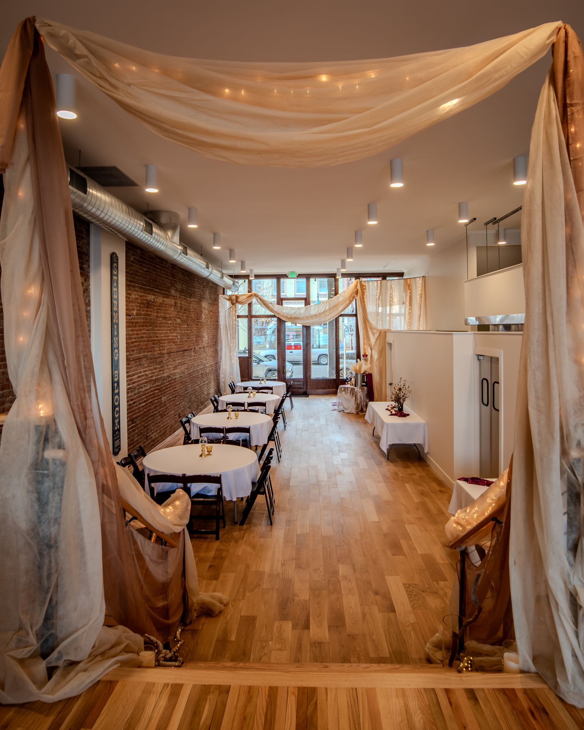 A large room with tables and chairs in it