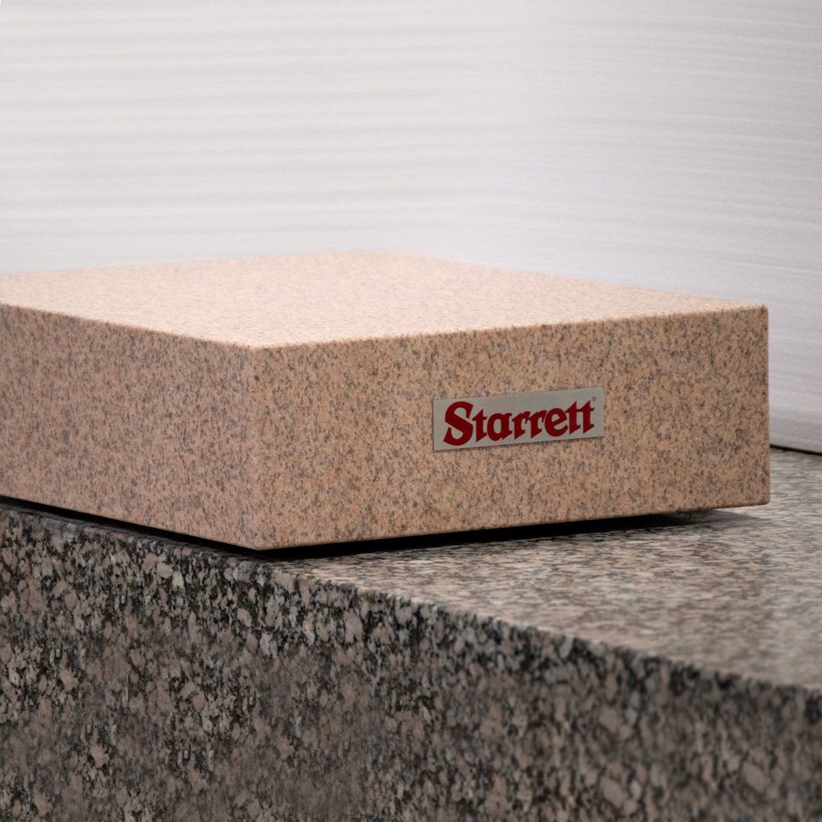 Pink granite surface plate with Starrett logo