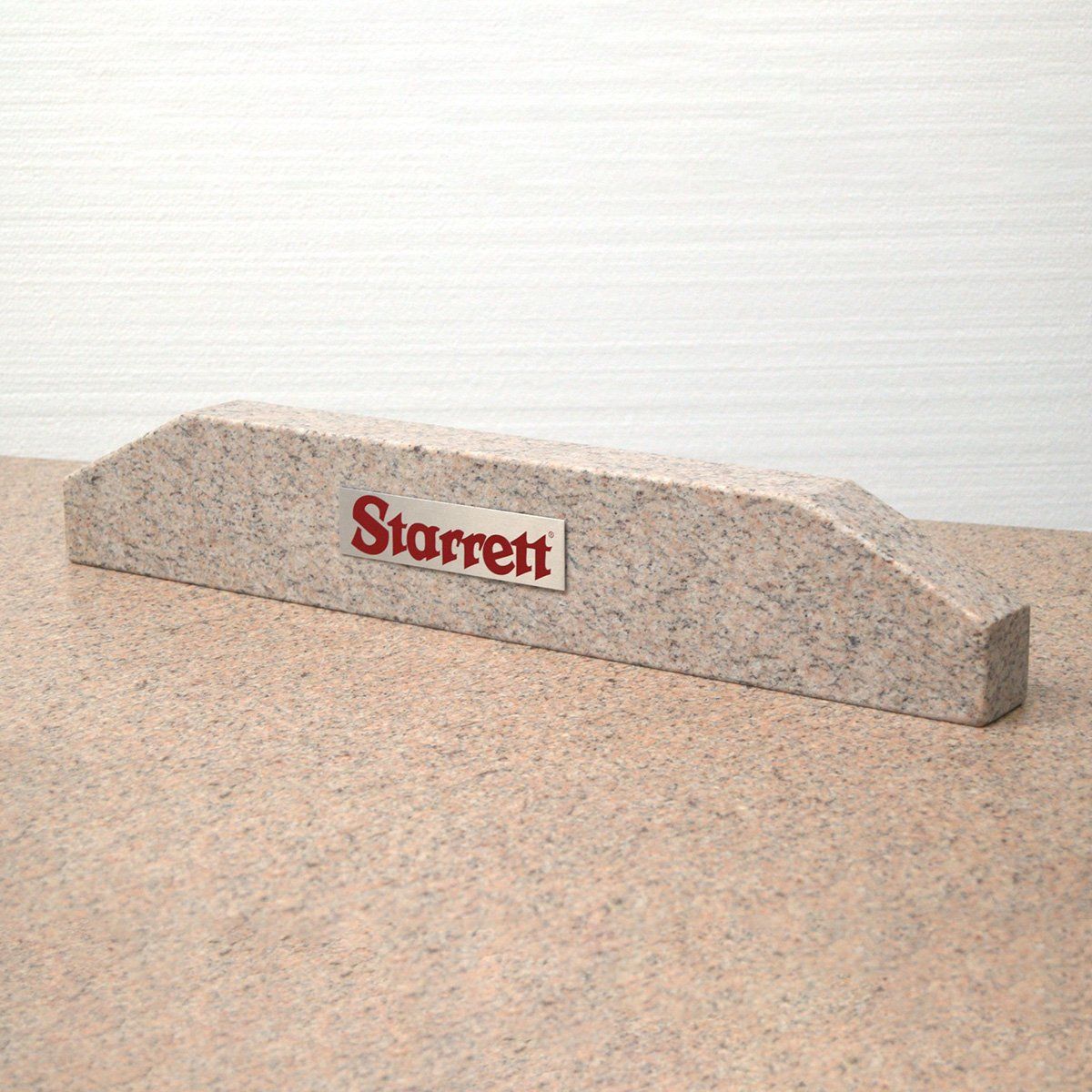 Pink granite straight edge with Starrett logo