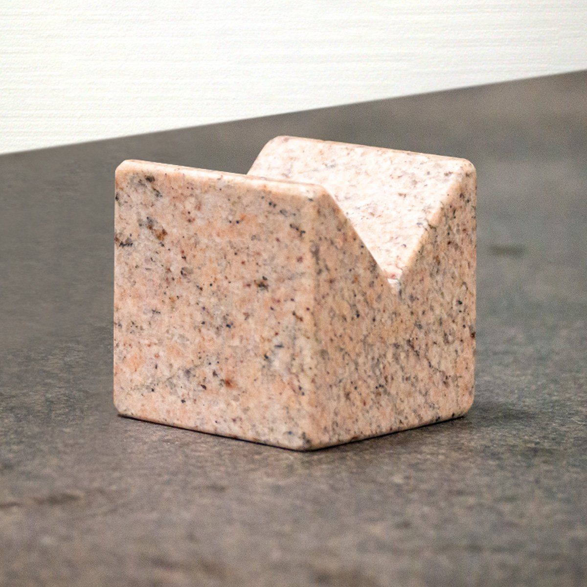 Pink granite cube with v-notch on top