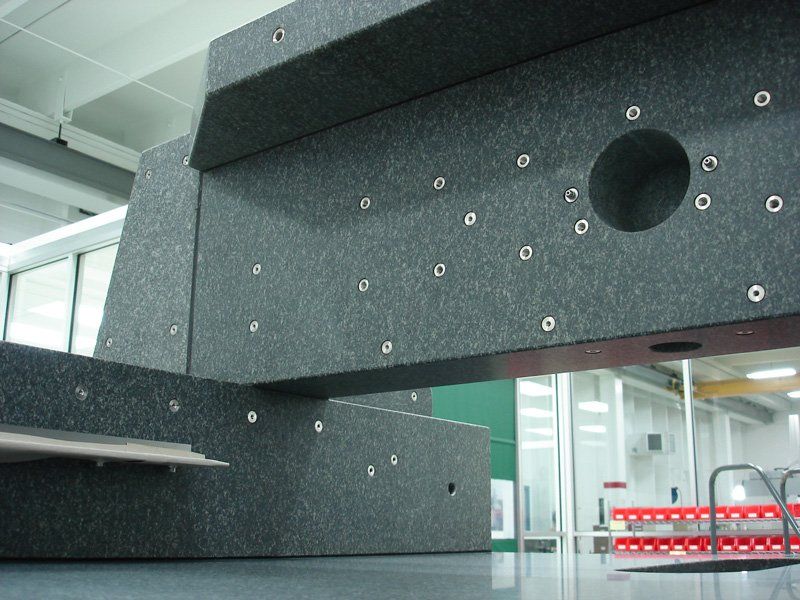 Assembly of black granite with inserts