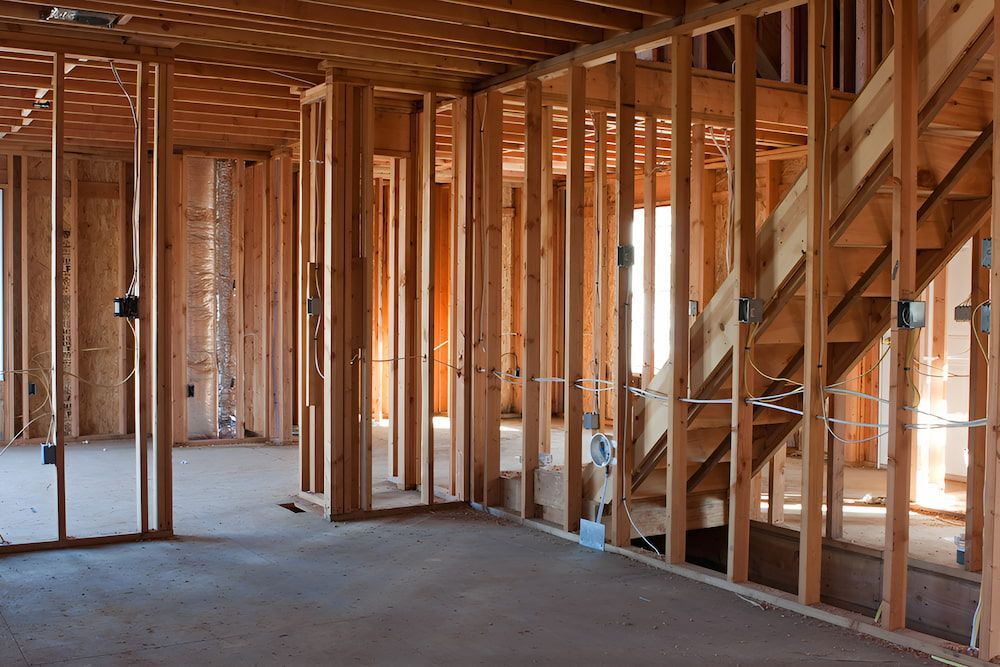 A Tractor Is Loading Lettuce Into A Truck In A Field — Homeland Electrical & Refrigeration In Braitling, NT