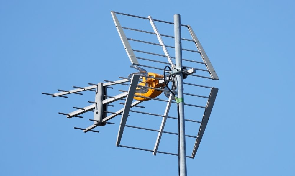 An Antenna On A Pole With A Blue Sky In The Background — Homeland Electrical & Refrigeration In Braitling, NT