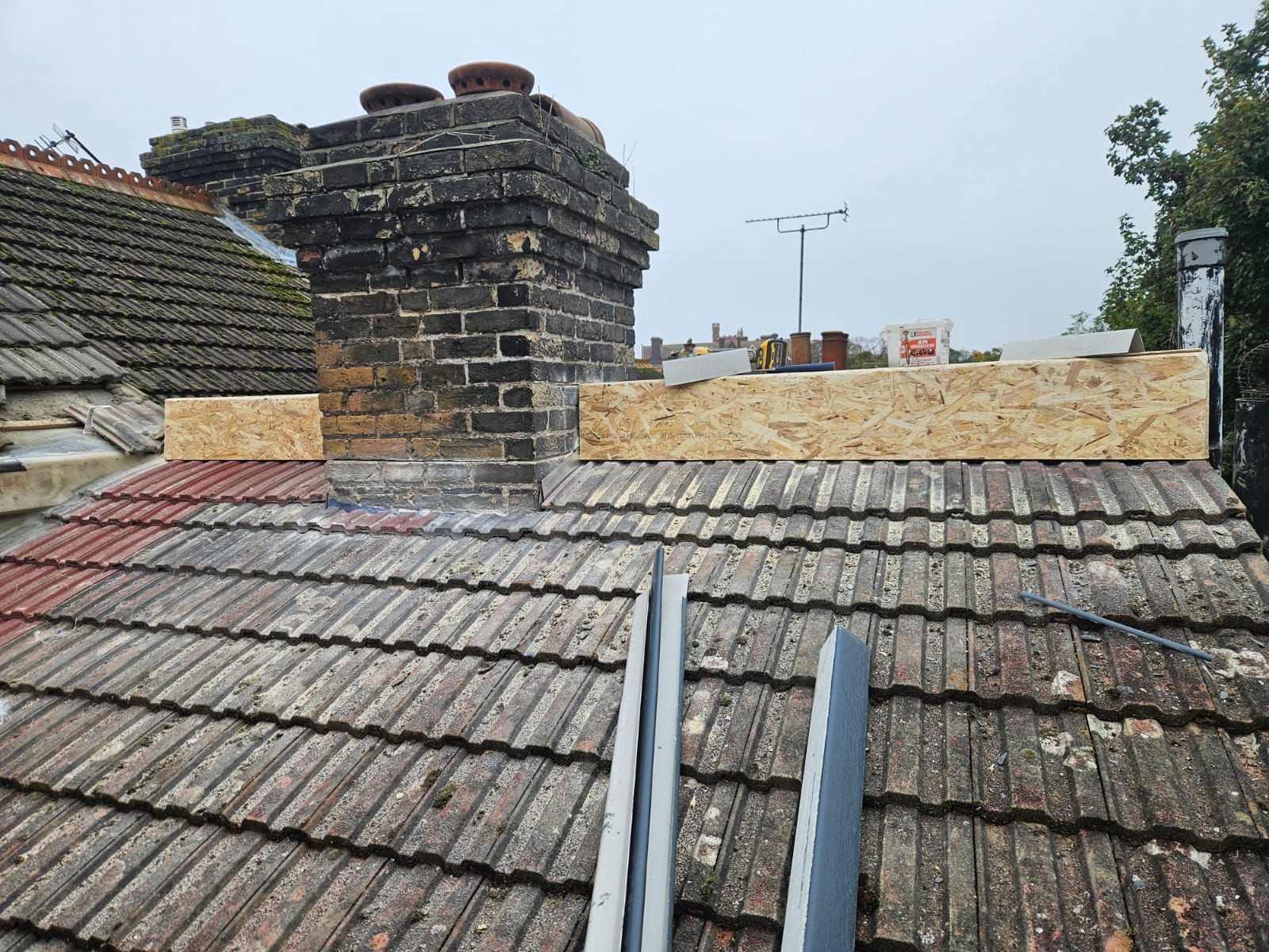 A roof with a chimney on top of it.