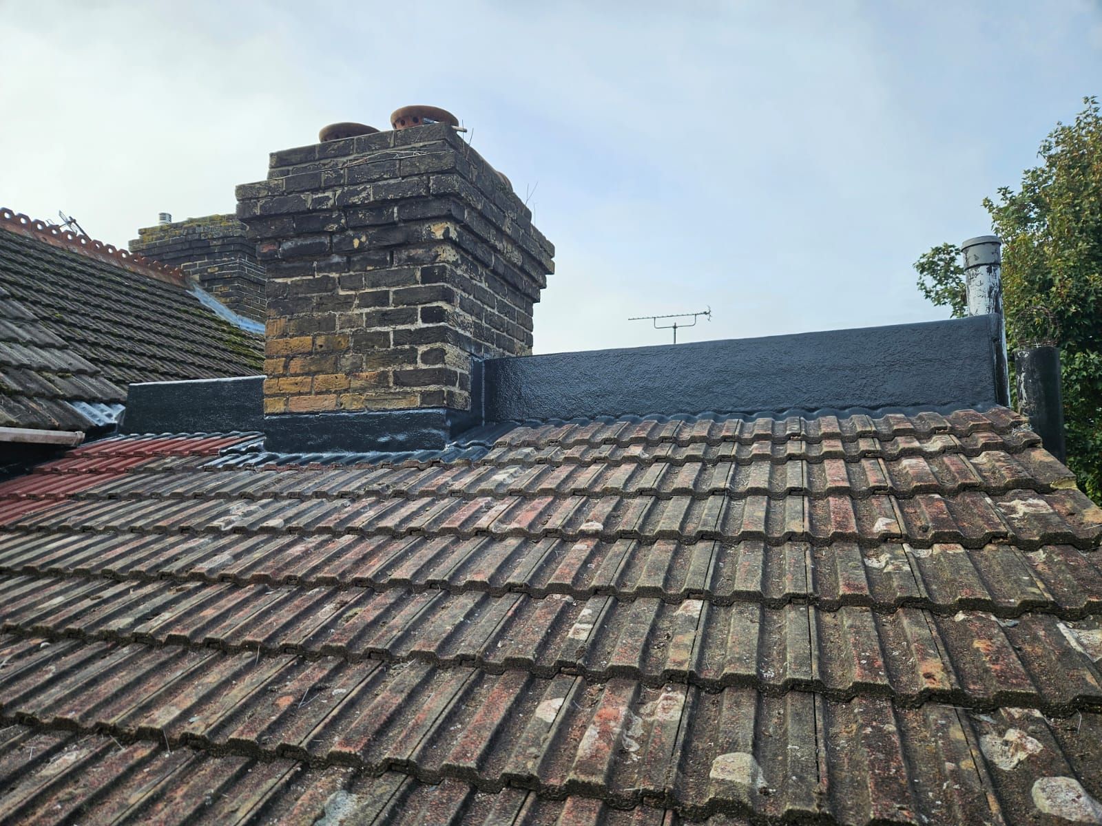 A roof with a chimney on top of it.