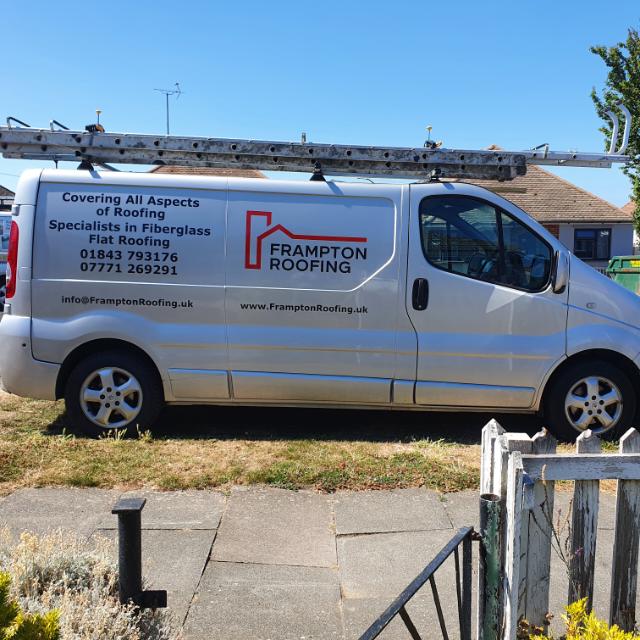 A frampton roofing van is parked on the side of the road