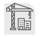 Construction site with crane lifting near buildings.