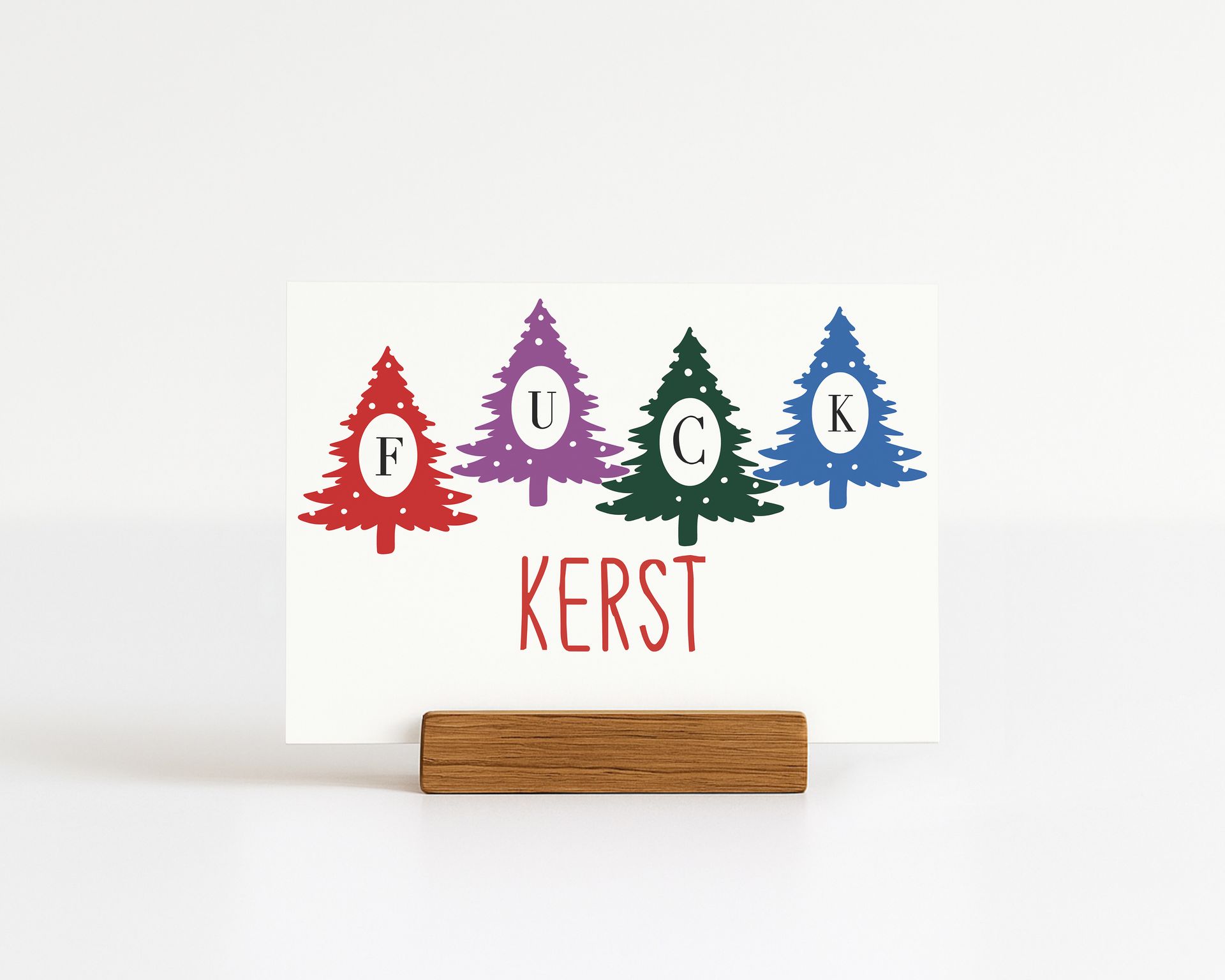 Card with "FUCK" spelled out in Christmas tree shapes, "KERST" below.