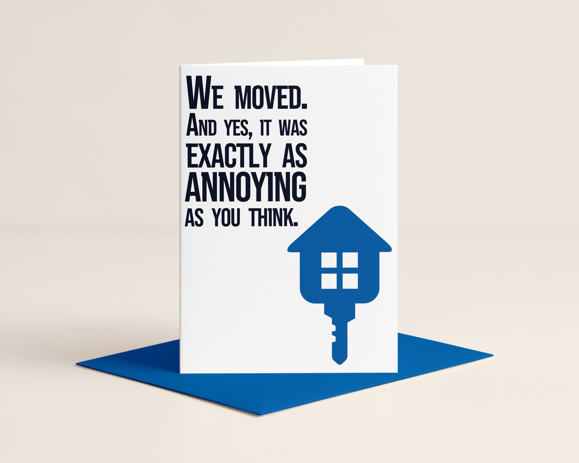 Moving card with the text “We moved. And yes, it was exactly as annoying as you think.” and a house-shaped key.