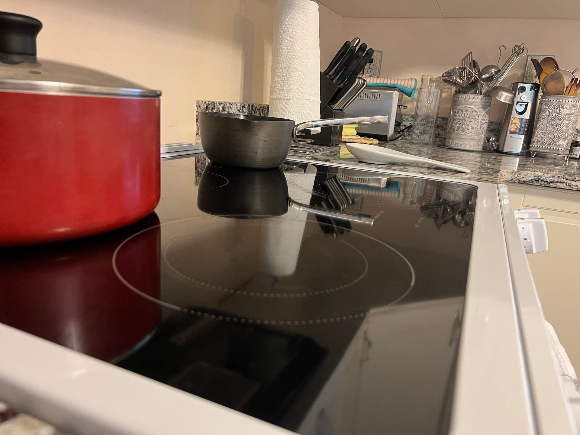 a pot is sitting on top of a stove in a kitchen