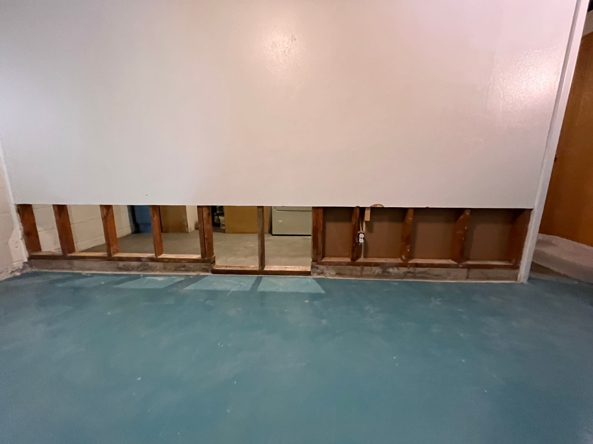 There is a hole in the wall in the basement.