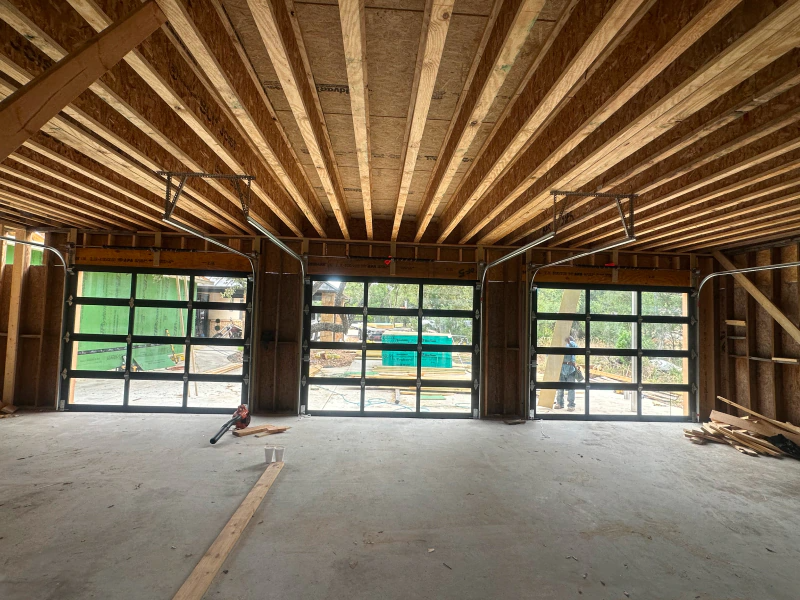 A garage under construction with a lot of windows