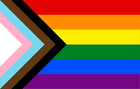 Progress pride flag with rainbow stripes and pink, blue, and white chevrons on the left