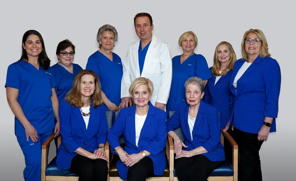Medical team wearing blue scrubs and jackets. Medical team wearing blue scrubs and jackets.