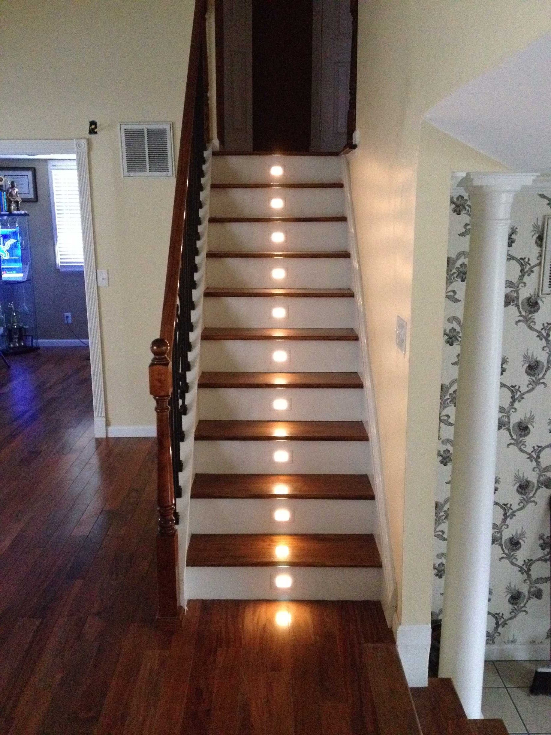 A set of stairs with lights on the steps