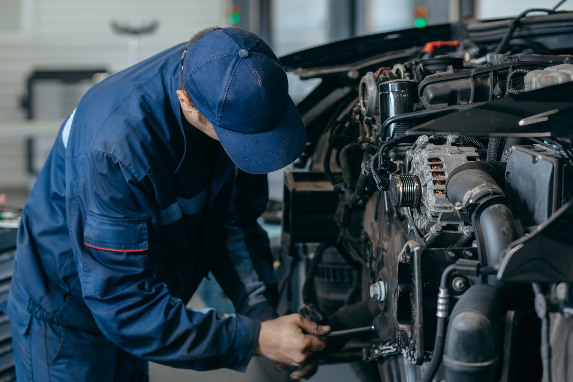 Auto mechanic repairs an engine. Replacing the timing chain.