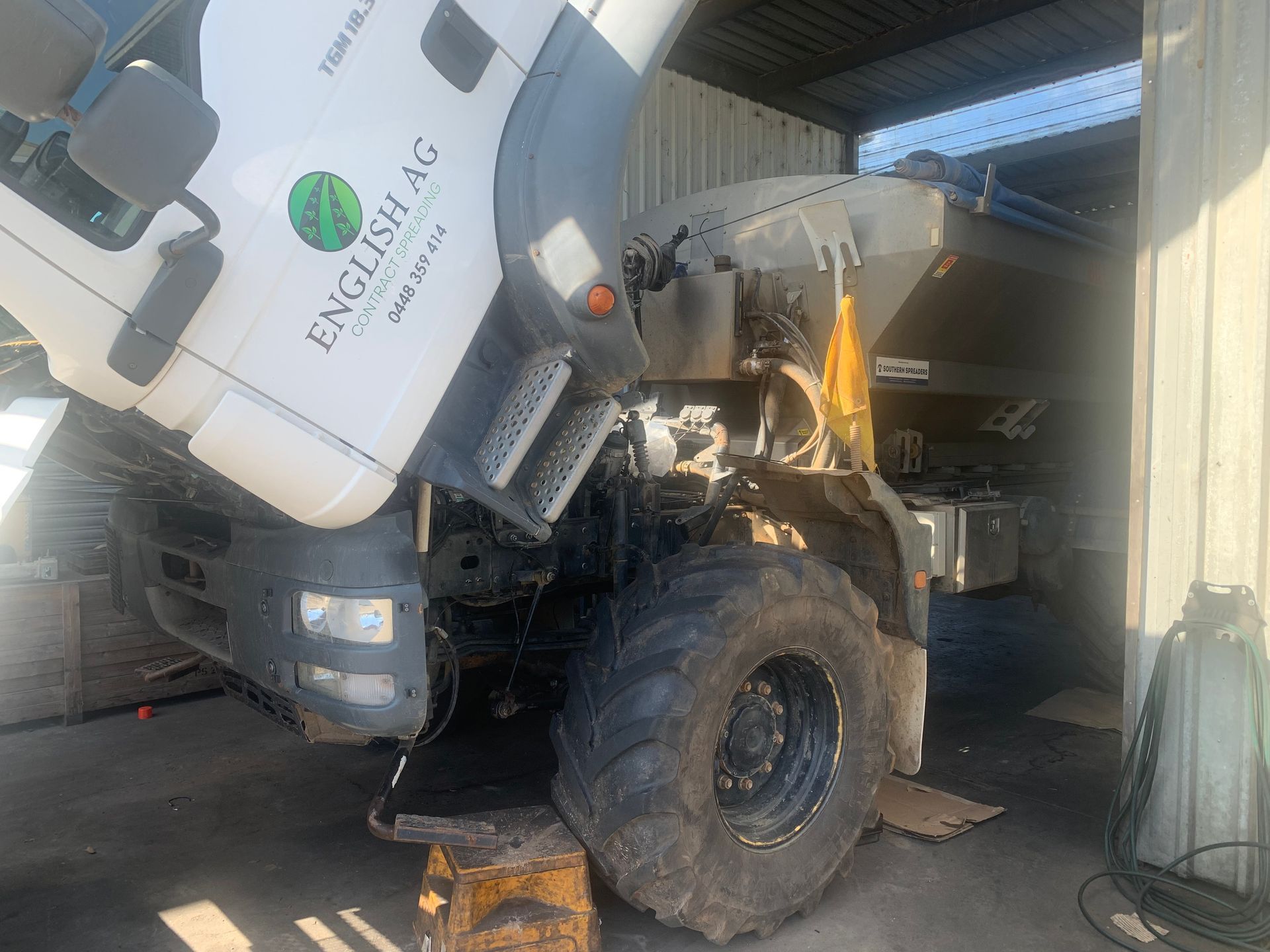 Close-up of a technician performing a truck repair.