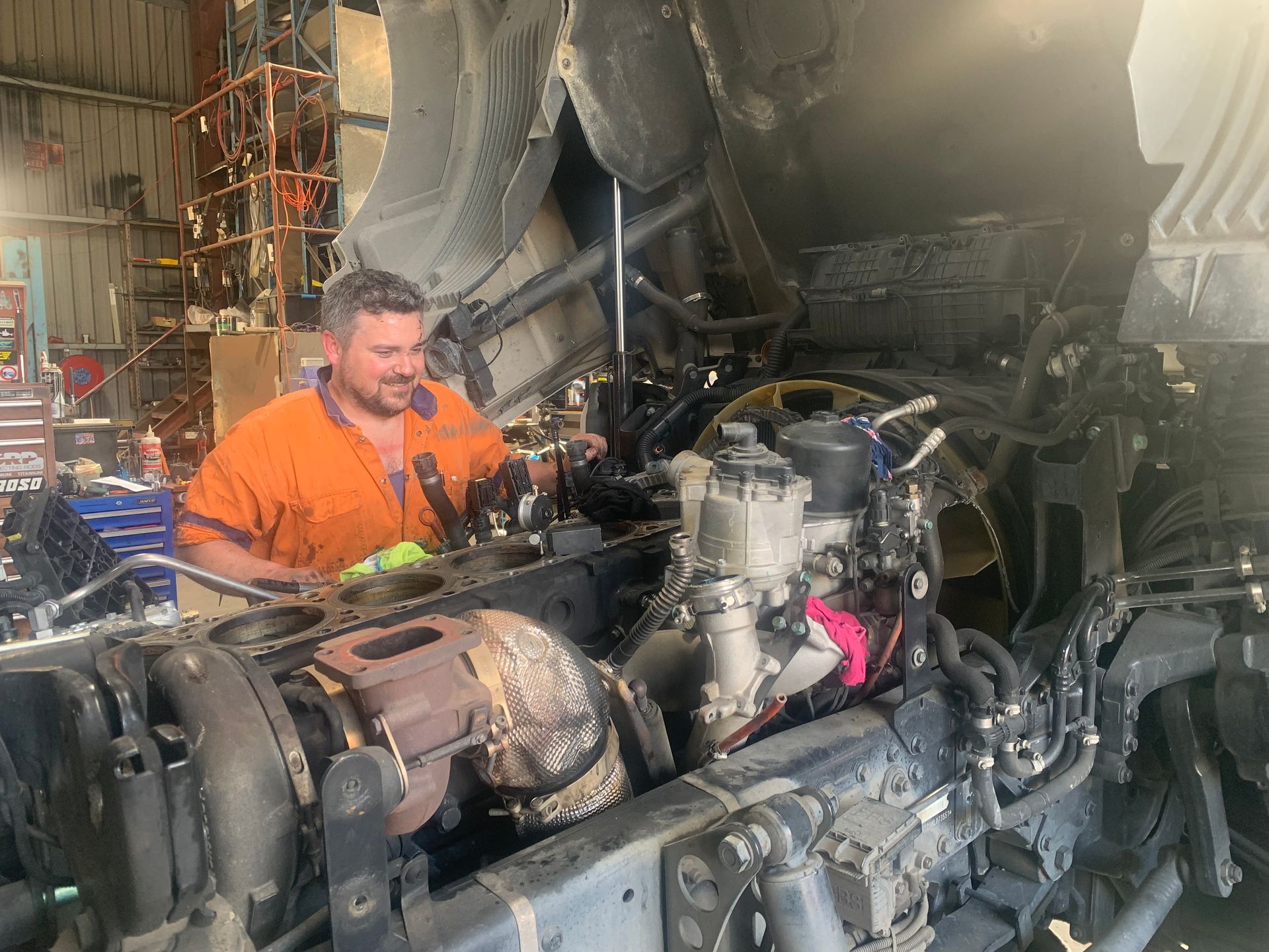 Professional bus mechanic working in vehicle repair service.