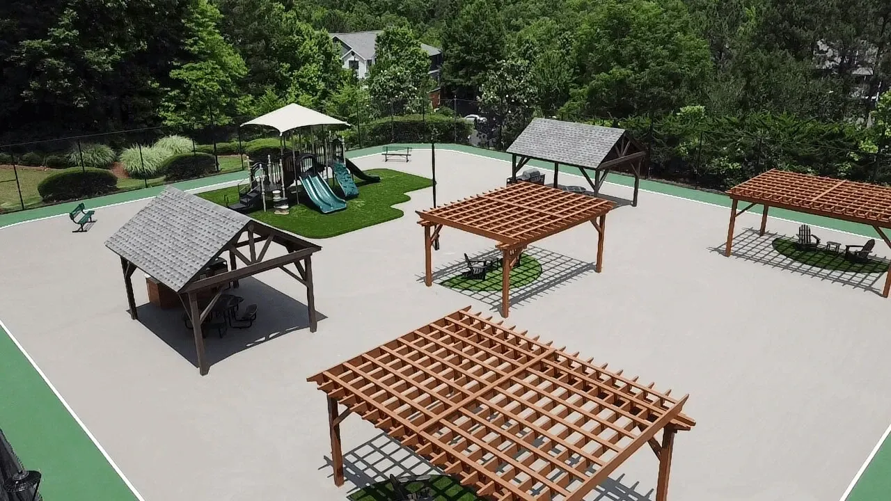 Park pavilion area with several wooden gazebos on a paved plaza surrounded by greenery Preserve at Mill Creek in Buford, GA