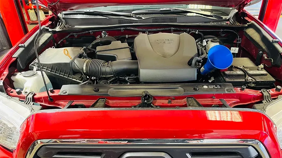 Transmission Fluid, red vehicle with hood up | Asian Imports Garage