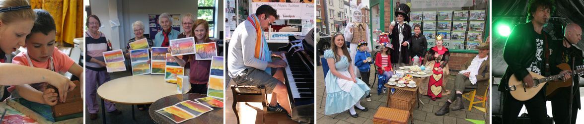 a group of people are standing around a table and a man is playing a guitar .