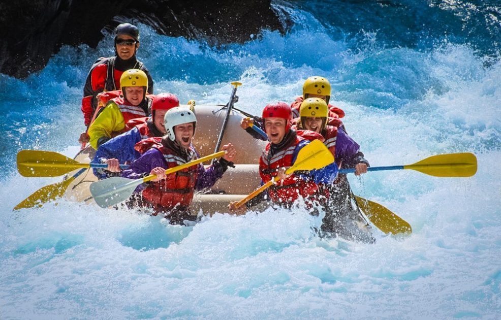 A group of people are rafting down a river.