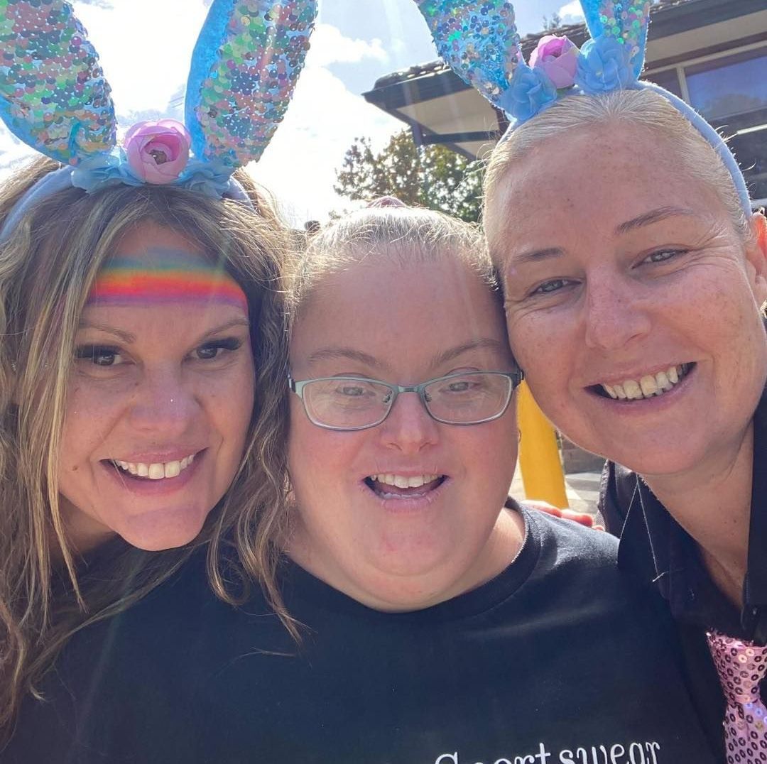 Respite care and supports. Three women wearing bunny ears are posing for a picture