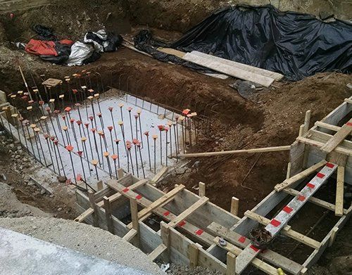 a construction site with a lot of wood and concrete