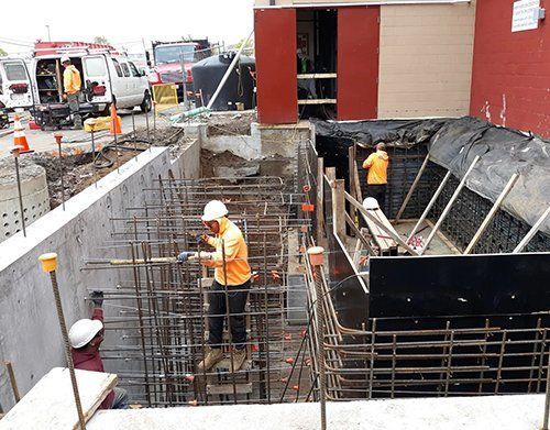 a group of construction workers are working on a construction site