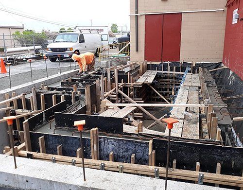 a construction site with a ford van in the background