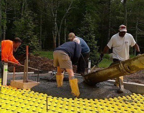 a group of men are working on a construction site