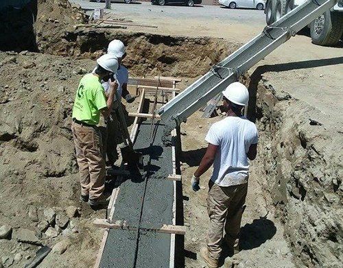 a group of construction workers are working on a construction site