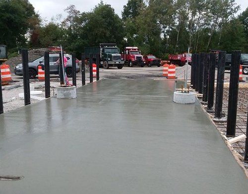 a concrete driveway is being built in a parking lot