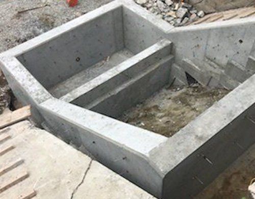 a large concrete block is sitting on top of a concrete surface