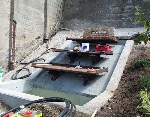 a concrete area with a few pieces of wood on it