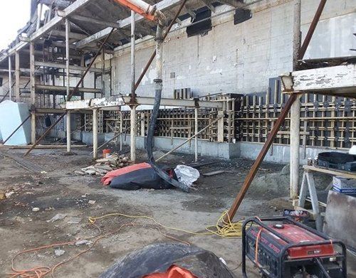 a generator is sitting in front of a building under construction