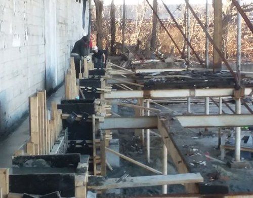 a group of people are working on a construction site