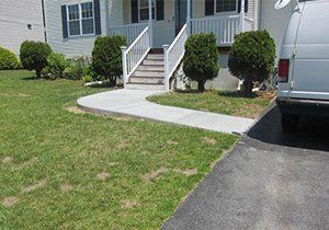 a white van is parked in front of a house
