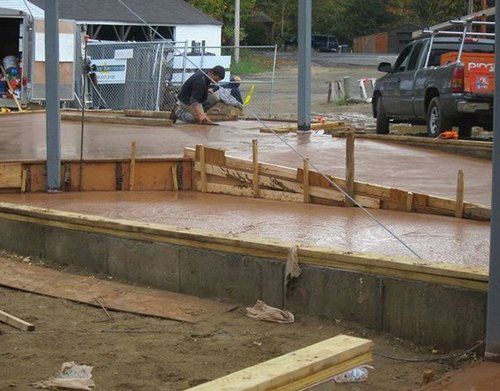 a construction site with a truck parked in the background