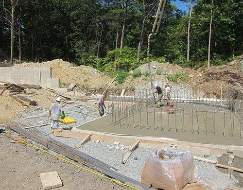 a group of construction workers are working on a construction site