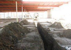 a pile of dirt is sitting in the middle of a construction site