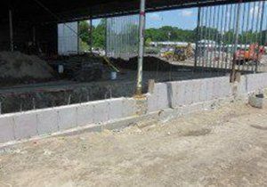 a fence is being built around a building under construction