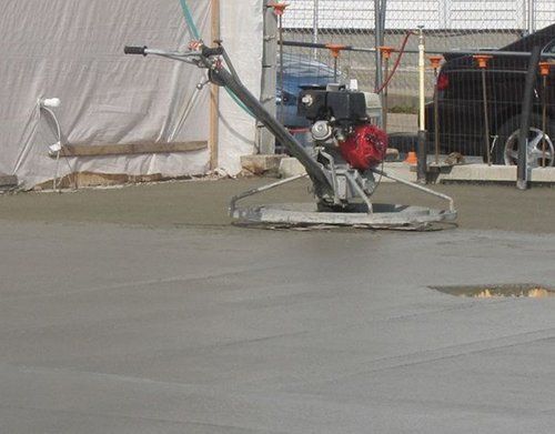 a machine is being used to level a concrete floor