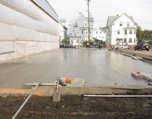 a concrete driveway is being built in front of a building