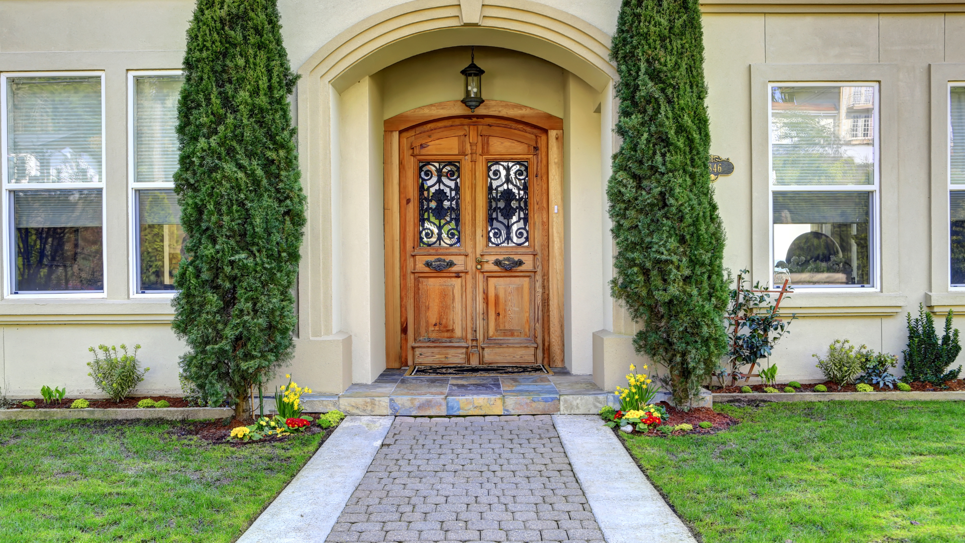there is a walkway leading to the front door of a house