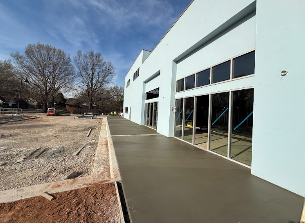 A large building with a concrete walkway leading to it