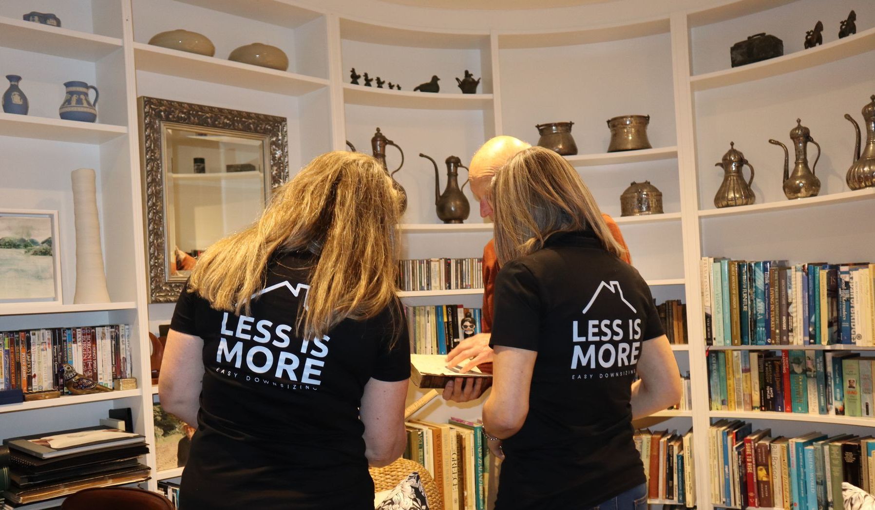 Melissa and Rachel in library with client